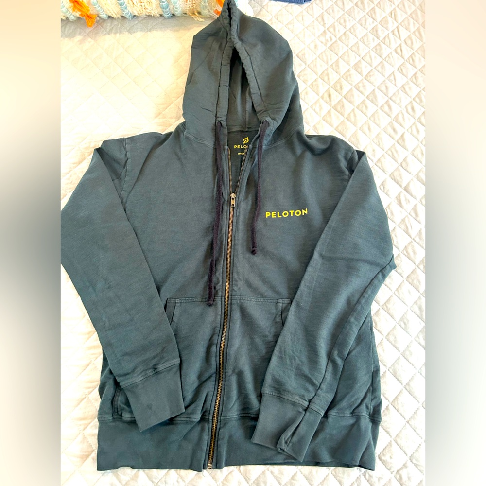 Peloton zip up hoodie with foil detail on front and back
